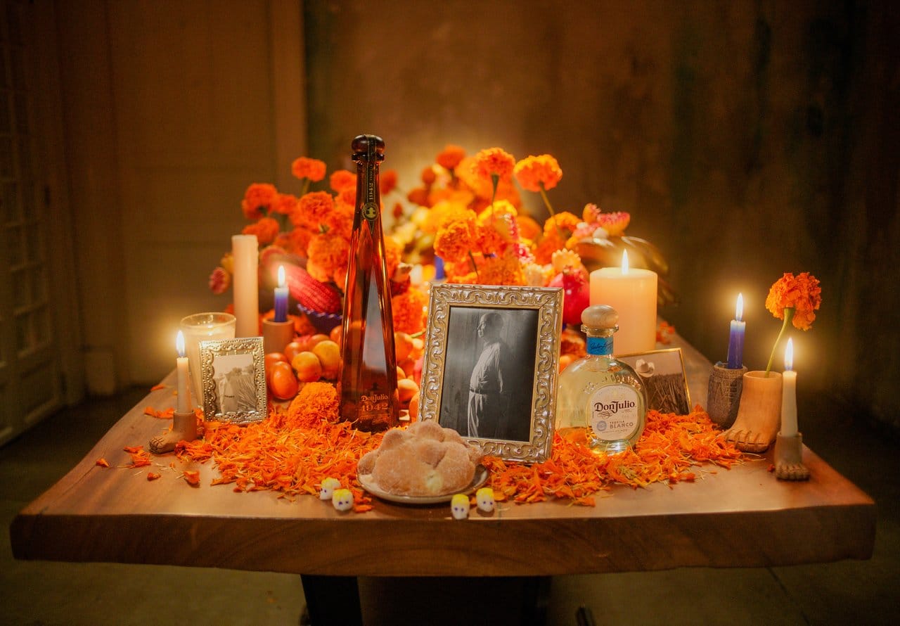 An Ofrenda (altar) adorned with pan de muerto, marigolds and Tequila Don Julio, a heartfelt tribute to love memory, and the traditions of Día de Muertos. Photo credit: The Maestros
