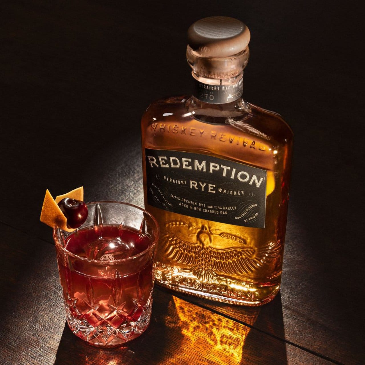 Redemption Whiskey’s Straight Rye Bottle and Black Cherry Old Fashioned Cocktail